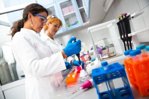 scientists researching in laboratory.