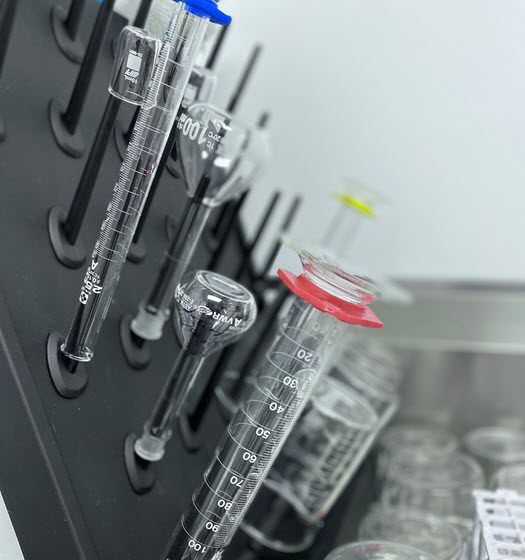 Lab beakers and test tubes on drying rack