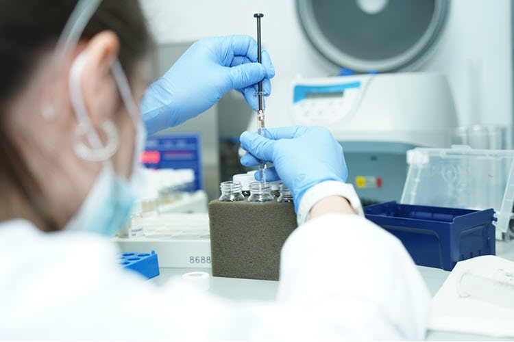 Woman testing cannabis products in MCS lab